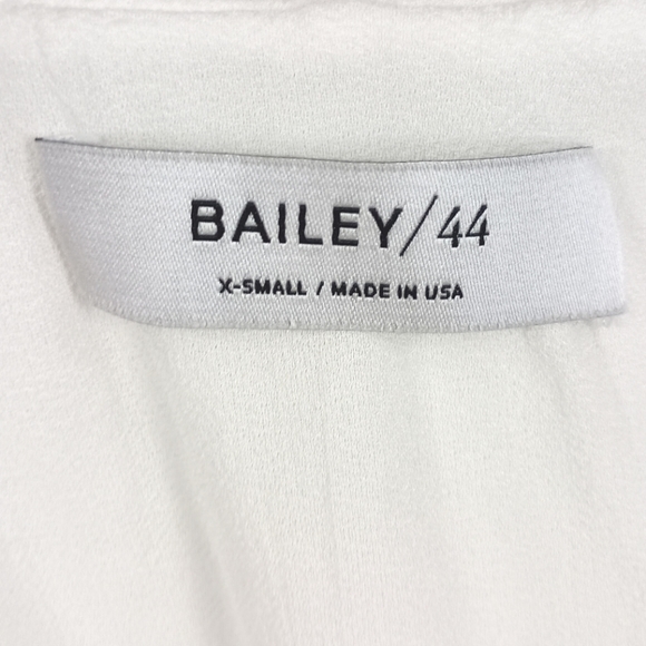 Aritzia Bailey 44 Ginger white asymmetrical ruffle cold shoulder blouse top - Picture 8 of 9